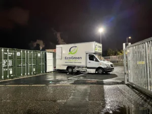 EcoGreen Movers removal van parked outside a UK home on moving day