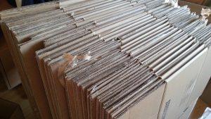 Cardboard moving boxes packed and ready for a house move