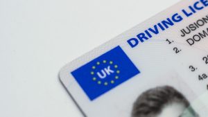 Close up of a UK photocard driving licence, illustrating how to change the address on a driving licence after moving