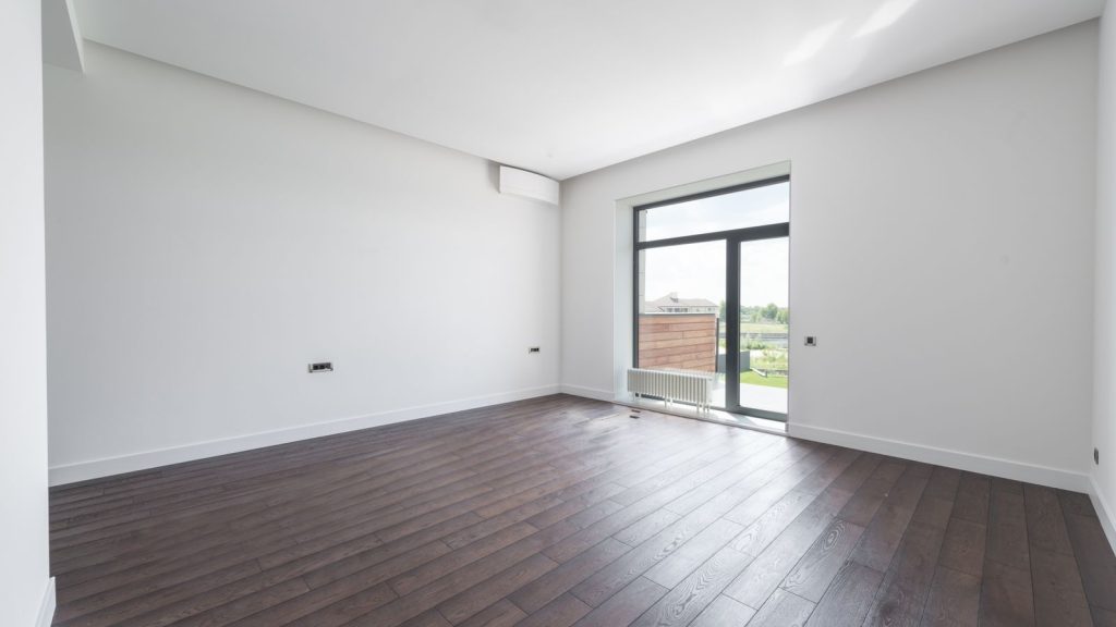 Empty room with parquet flooring