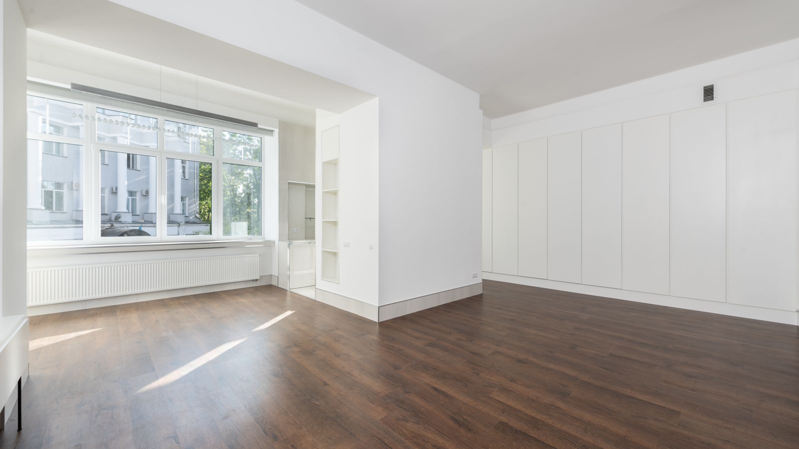Bright empty room with large windows
