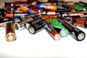 Used household batteries collected together ready for recycling
