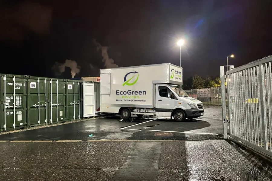 EcoGreen Movers removal van parked outside a UK home on moving day