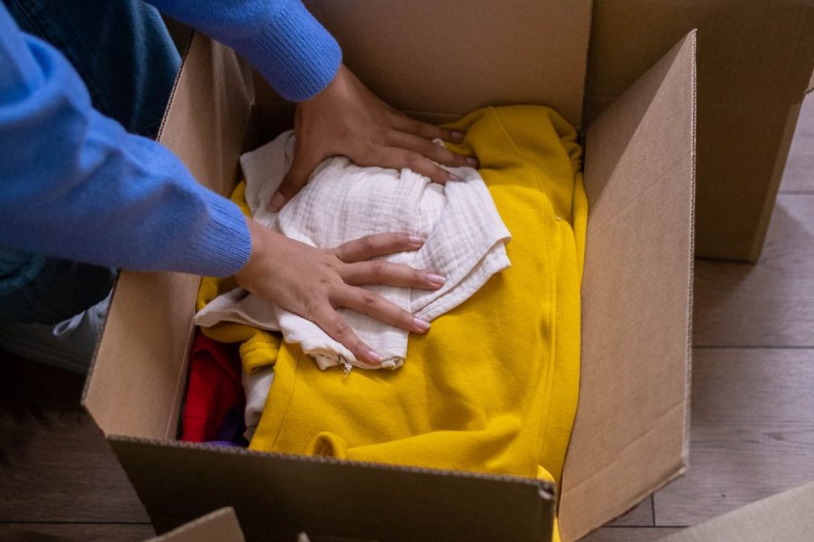 Household items being sorted into cardboard boxes before a move